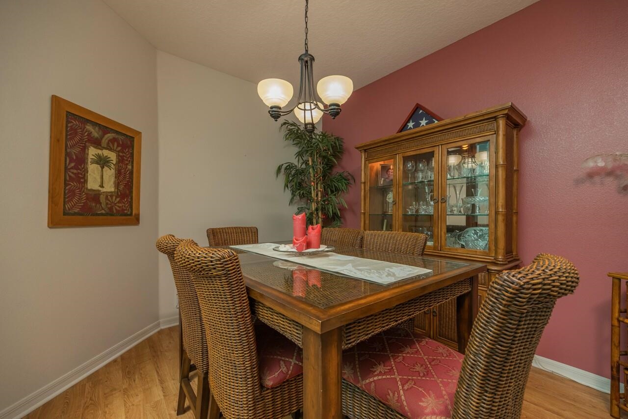 1041 Ridgewood Lane St. Augustine, FL 32086 - Photo 5 of 40 a view of a dining room with furniture and wooden floor