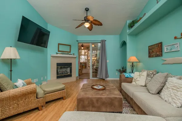 a living room with furniture and a fireplace