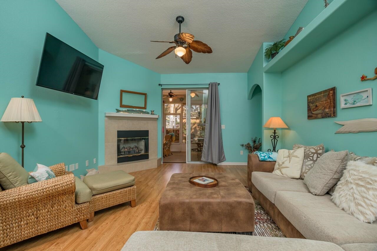 1041 Ridgewood Lane St. Augustine, FL 32086 - Photo 7 of 40 a living room with furniture and a fireplace