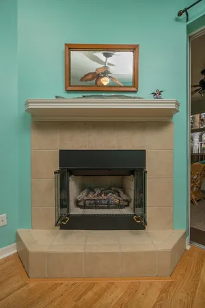 a fireplace with a vase on top of it