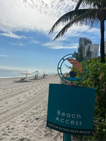 a view of a pathway with a wrought fence