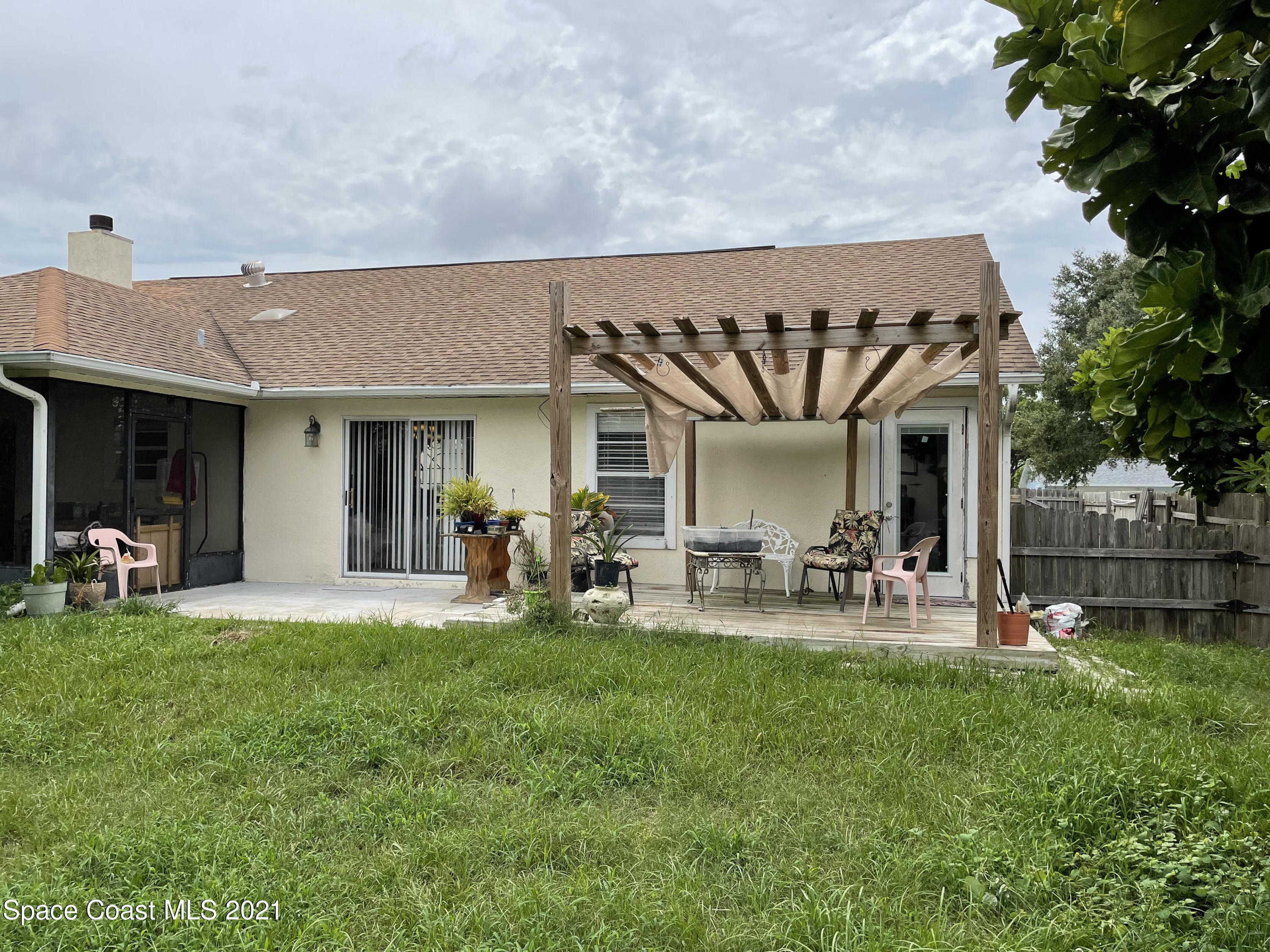 751 Becker Avenue Northeast Palm Bay, FL 32905 - Photo 18 of 20 Backyard Patio and Pergola
