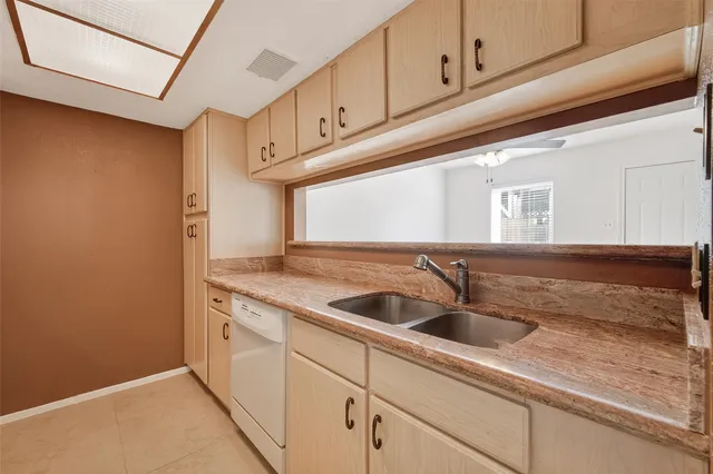 a kitchen with a sink and cabinets