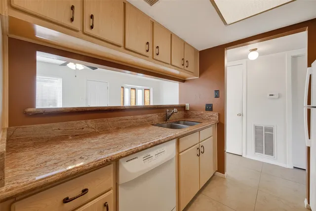 a kitchen with stainless steel appliances granite countertop a sink and cabinets