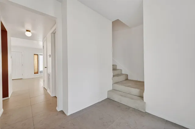 a view of a hallway with rooms