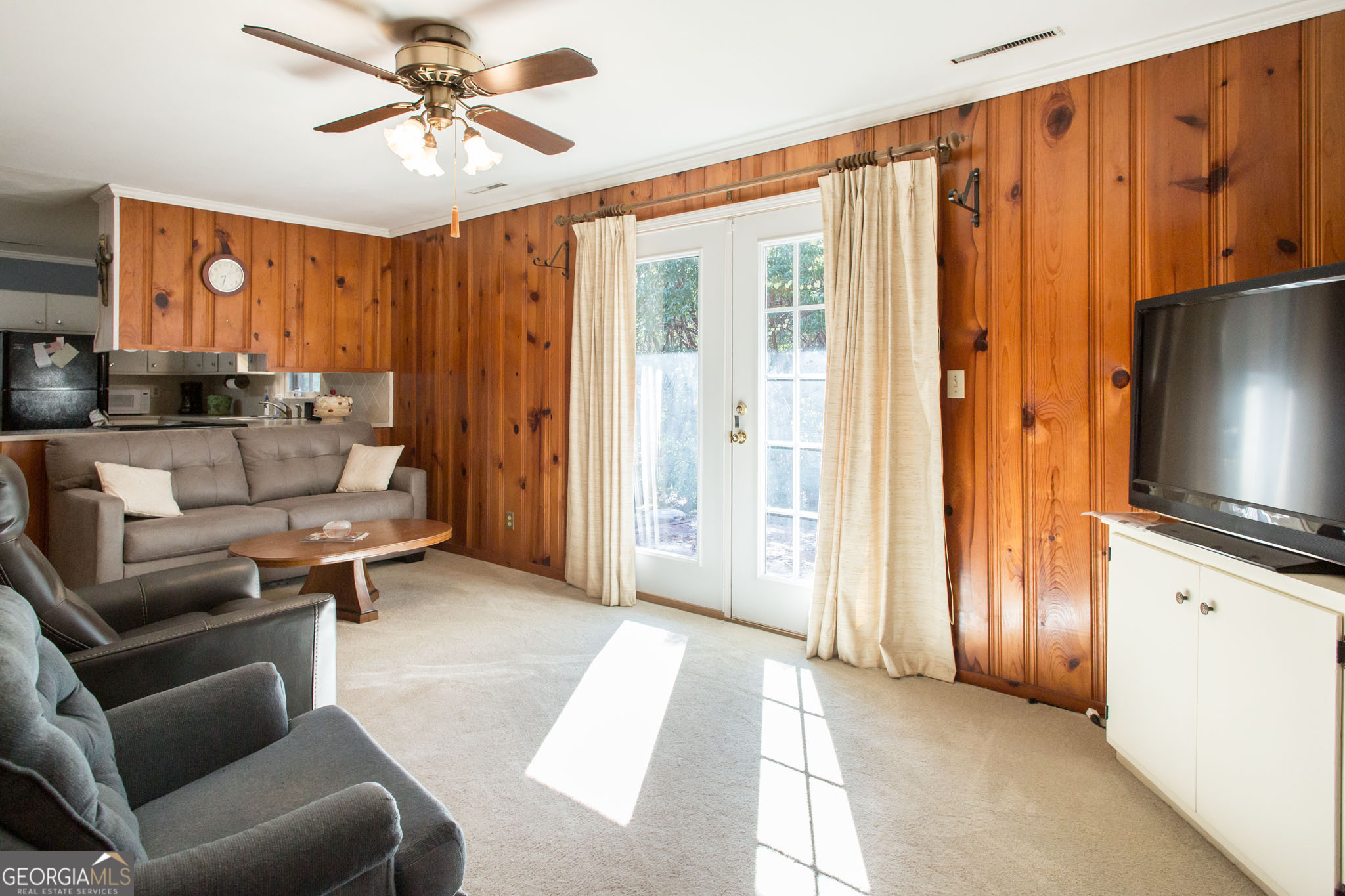 403 Preston Street Waycross, GA 31501 - Photo 17 of 36 a living room with furniture and a flat screen tv