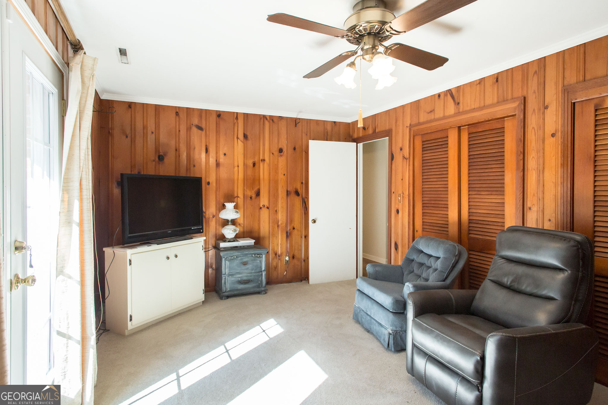 403 Preston Street Waycross, GA 31501 - Photo 19 of 36 a living room with furniture and a flat screen tv