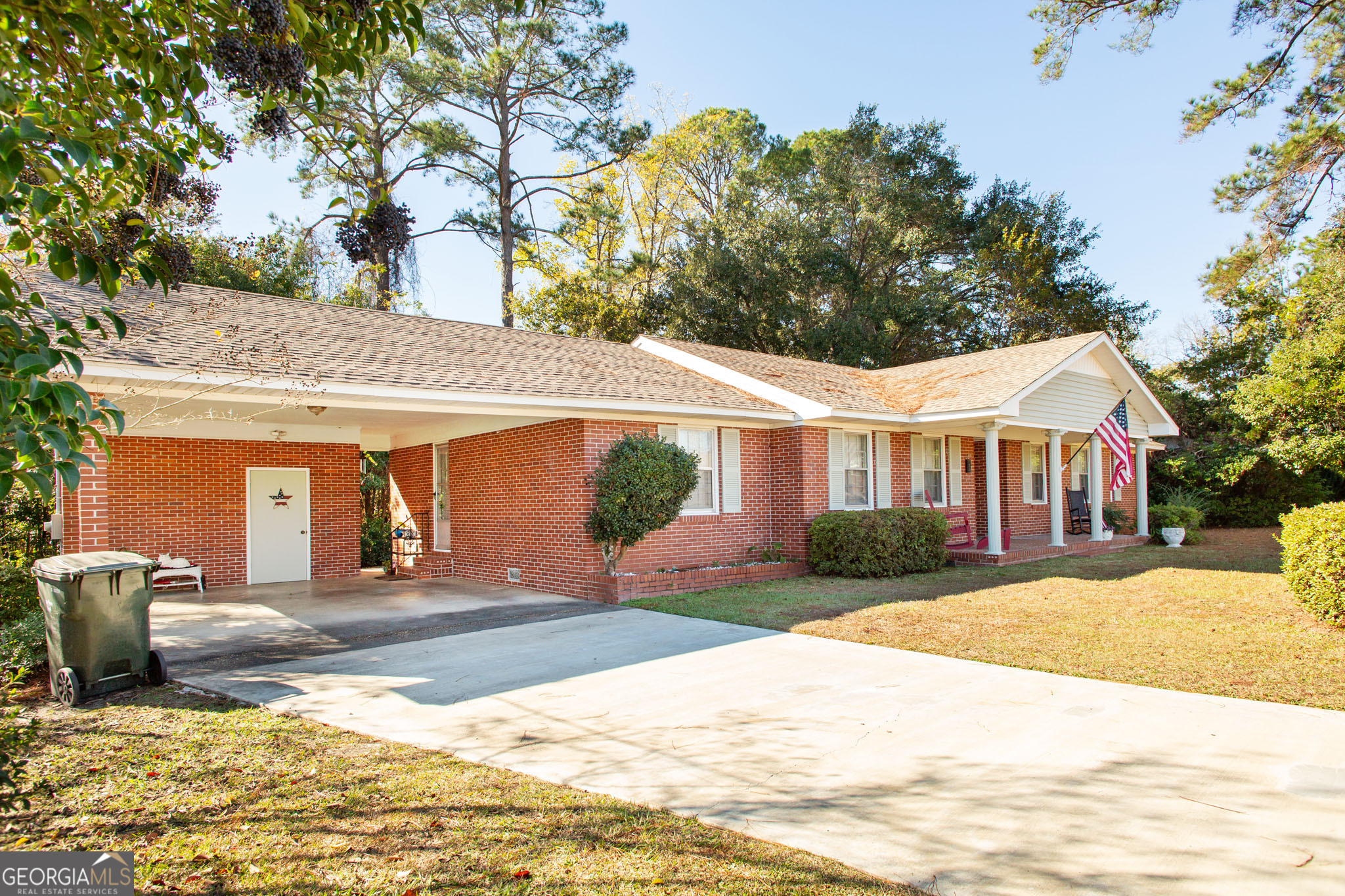 403 Preston Street Waycross, GA 31501 - Photo 2 of 36 a front view of a house with a yard and garage