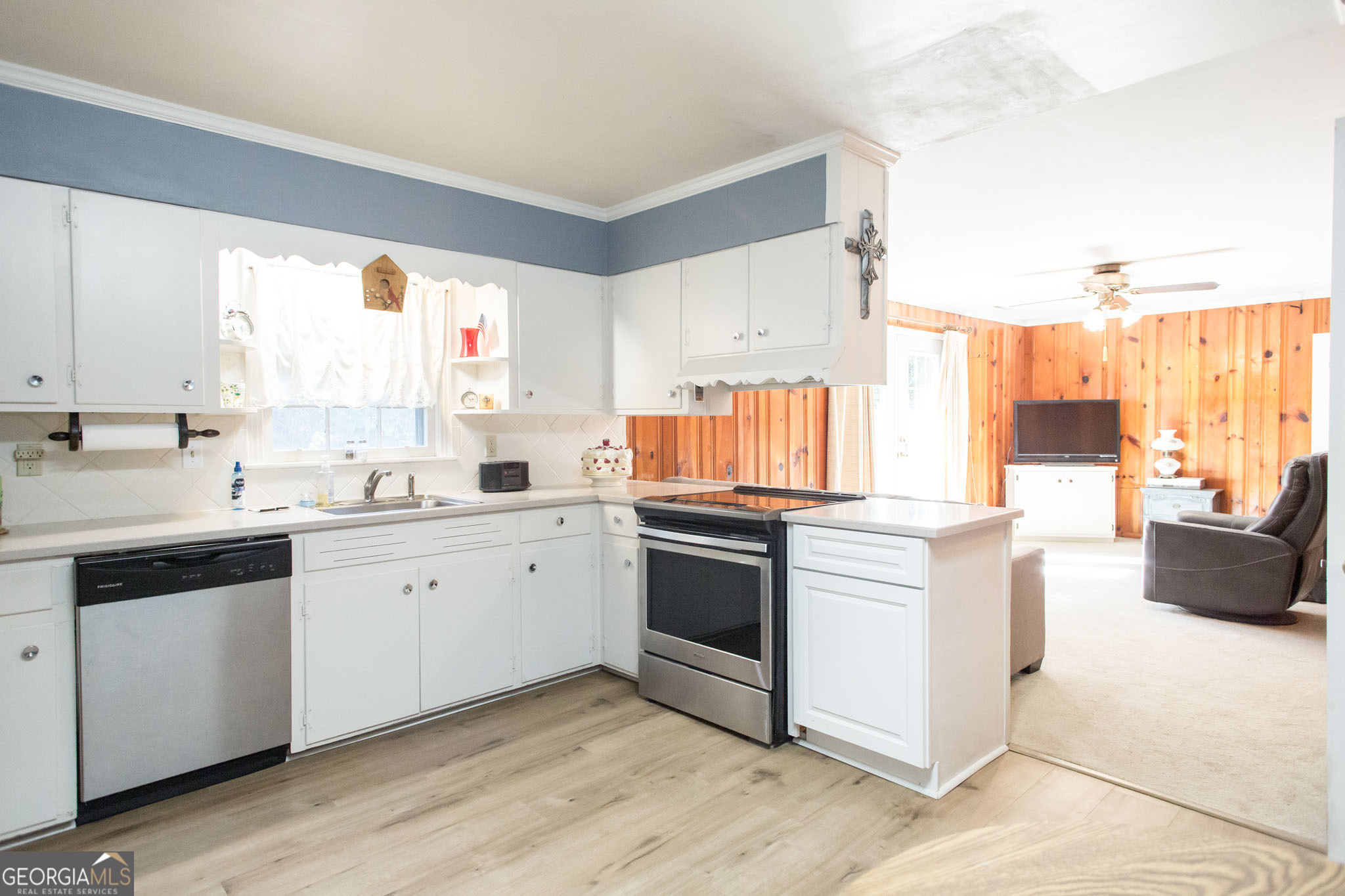 403 Preston Street Waycross, GA 31501 - Photo 21 of 36 a kitchen with stainless steel appliances white cabinets a sink and a stove