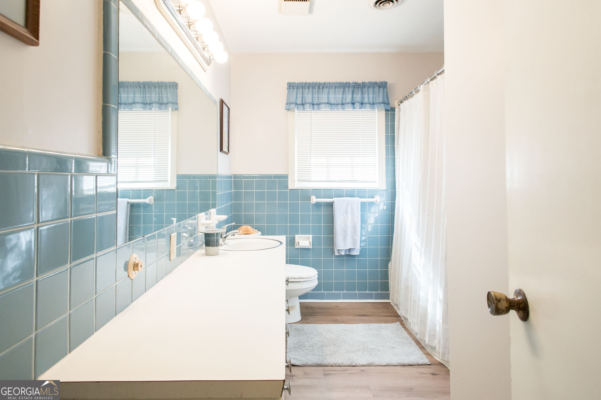403 Preston Street Waycross, GA 31501 - Photo 25 of 36 a bathroom with a sink a toilet and shower