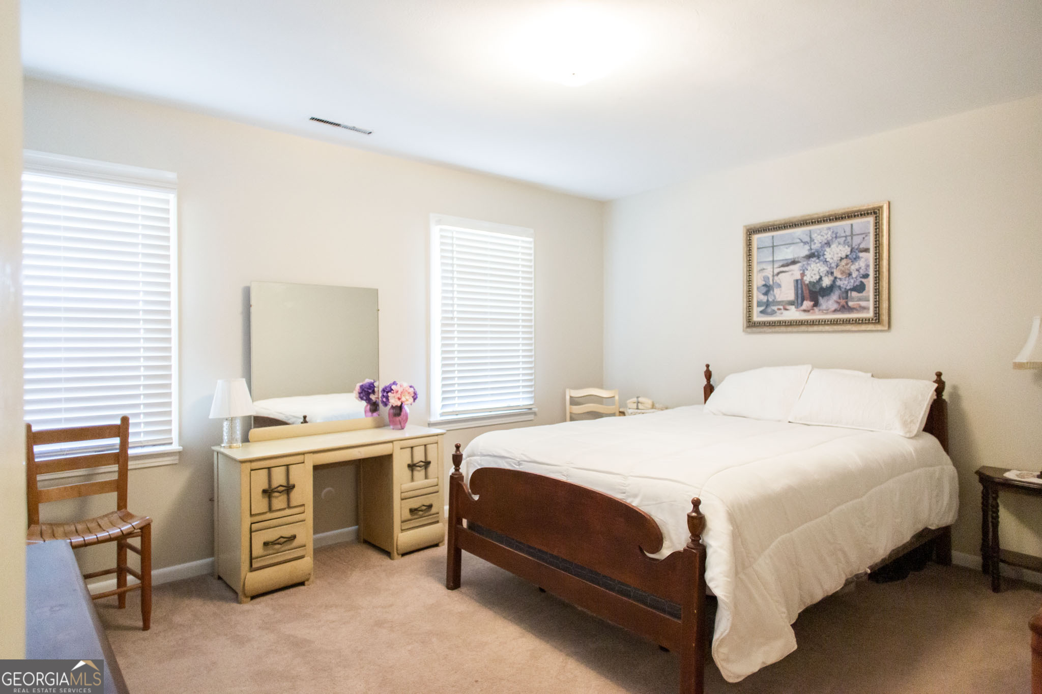 403 Preston Street Waycross, GA 31501 - Photo 27 of 36 a bedroom with a bed and a table