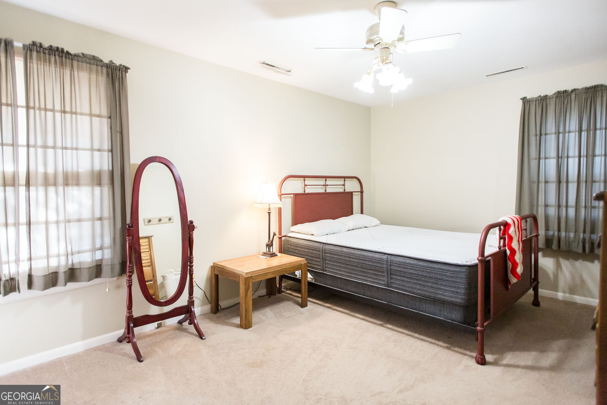 403 Preston Street Waycross, GA 31501 - Photo 31 of 36 a bedroom with bed and a window