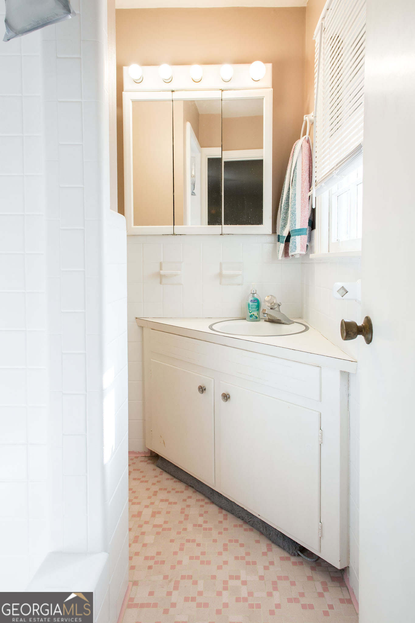 403 Preston Street Waycross, GA 31501 - Photo 33 of 36 a bathroom with a sink and a mirror