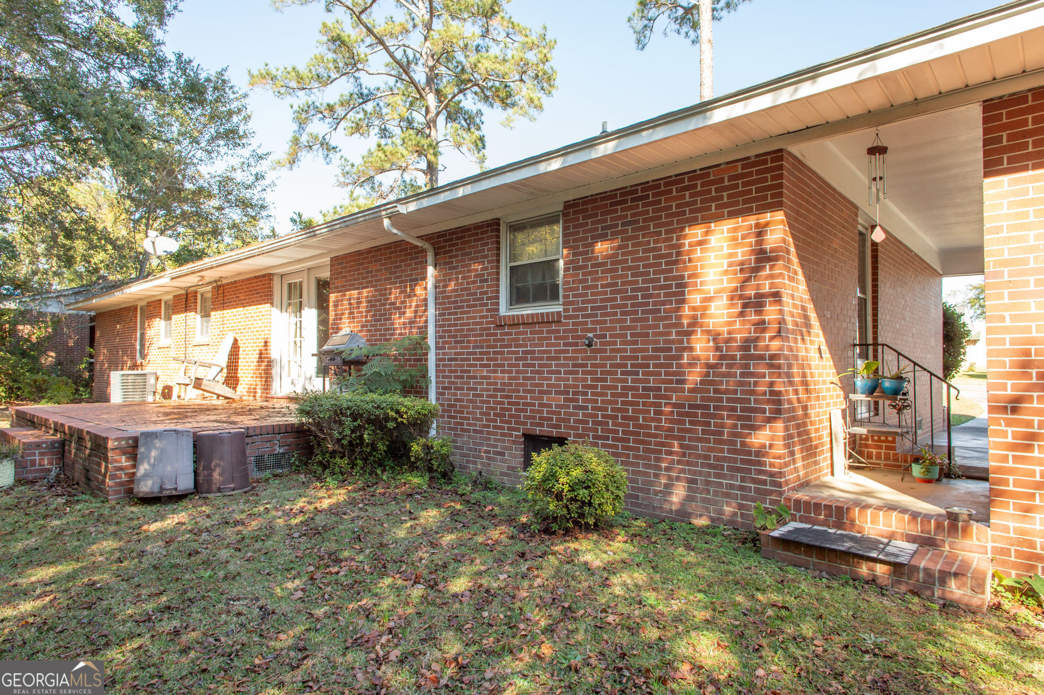 403 Preston Street Waycross, GA 31501 - Photo 10 of 36 a view of a house with backyard and sitting area