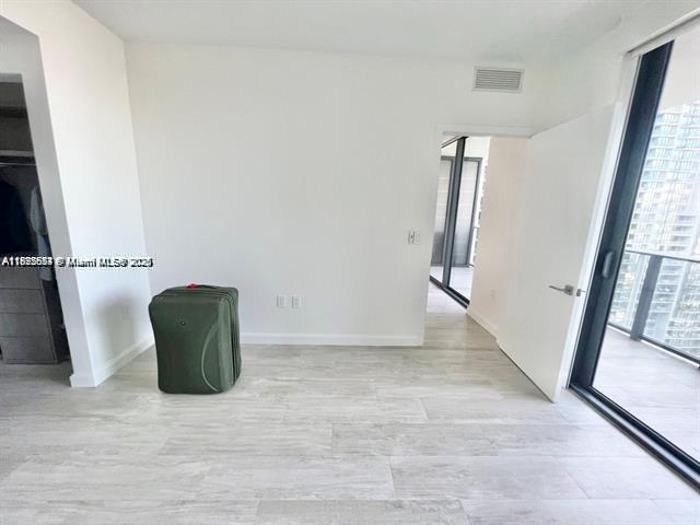 45 Southwest 9th Street, Unit 3009 Miami, FL 33130 - Photo 12 of 35 an entryway with wooden floor and a window
