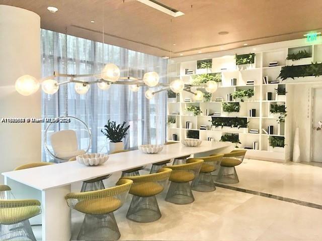 45 Southwest 9th Street, Unit 3009 Miami, FL 33130 - Photo 25 of 35 a living room with furniture and a large window