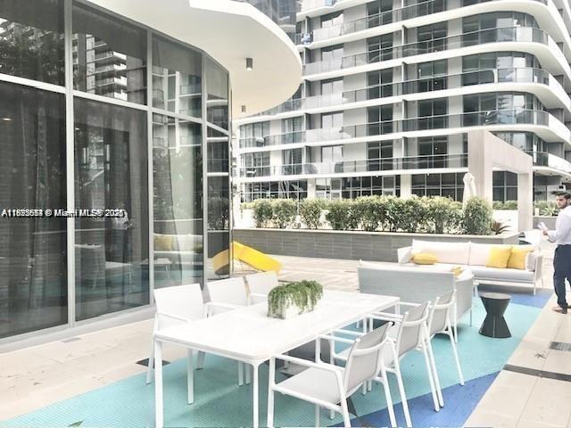 45 Southwest 9th Street, Unit 3009 Miami, FL 33130 - Photo 26 of 35 a view of a swimming pool with a patio