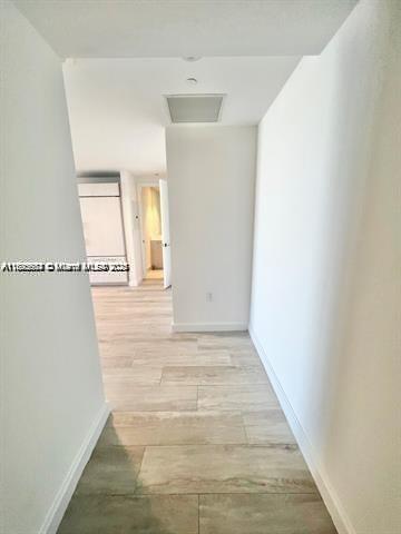 45 Southwest 9th Street, Unit 3009 Miami, FL 33130 - Photo 3 of 35 a view of a hallway with wooden floor