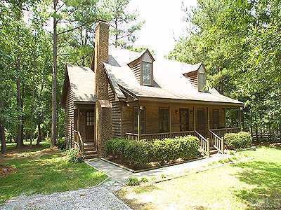 1614 Ranch Road Clayton, NC 27520 - Photo 1 of 1 a front view of a house with garden
