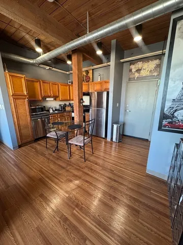 a view of a livingroom with furniture and wooden floor