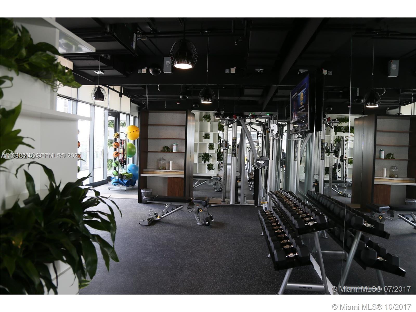 55 Southwest 9th Street, Unit 3709 Miami, FL 33130 - Photo 33 of 52 a view of a room with gym equipment