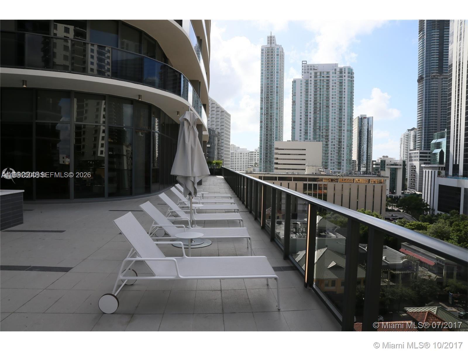55 Southwest 9th Street, Unit 3709 Miami, FL 33130 - Photo 45 of 52 a view of a balcony with chairs