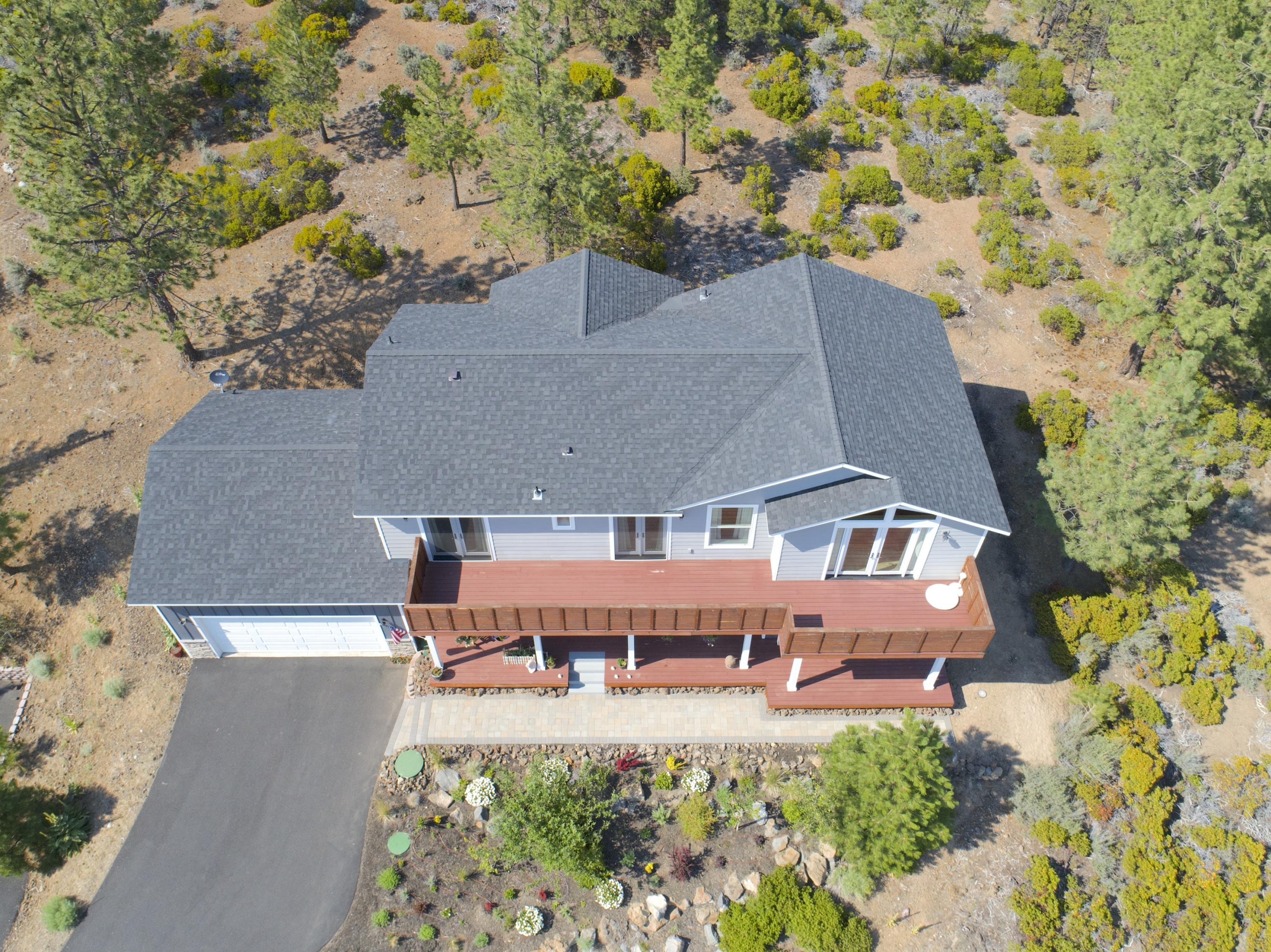 19112 Pumice Butte Road Bend, OR 97702 - Photo 35 of 36 an aerial view of a house with yard swimming pool and outdoor seating