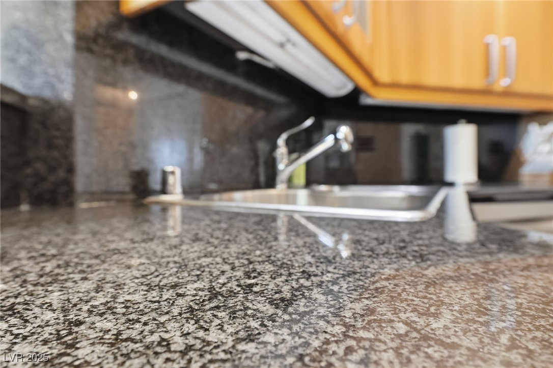2747 Paradise Road, Unit 1205 Las Vegas, NV 89109 - Photo 19 of 32 Kitchen view of a sink and light stone countertops