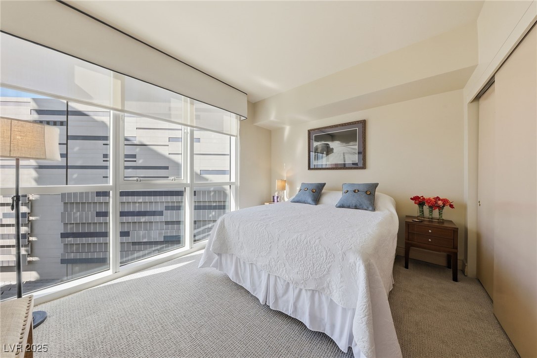 2747 Paradise Road, Unit 1205 Las Vegas, NV 89109 - Photo 3 of 32 Bedroom with carpet and a closet