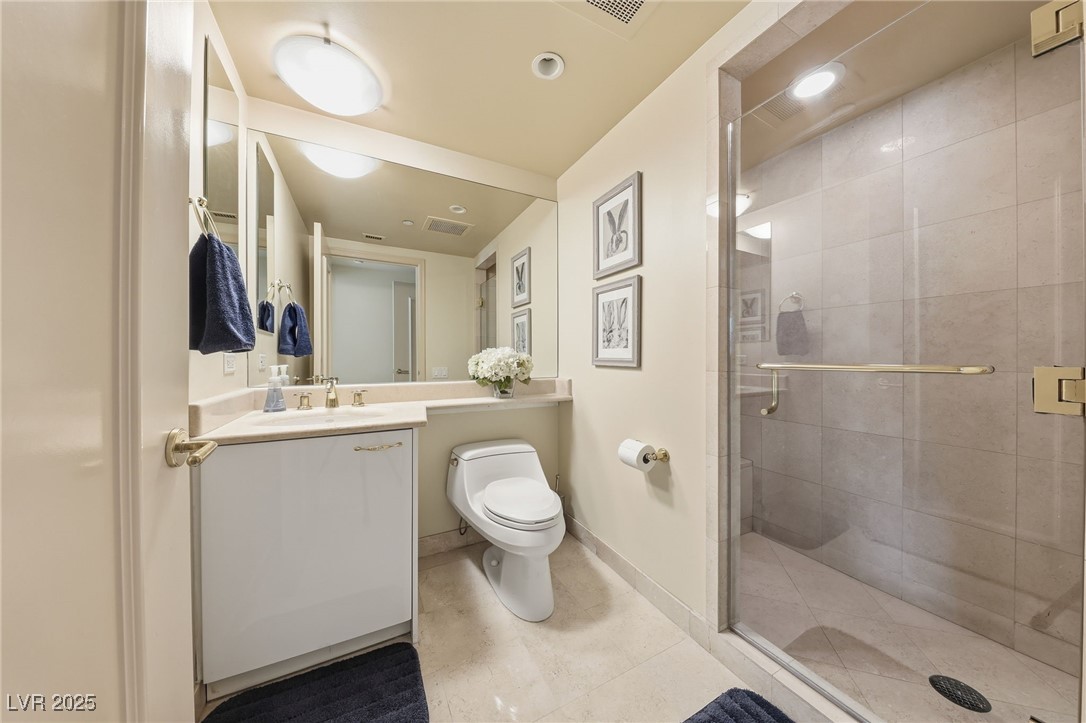 2747 Paradise Road, Unit 1205 Las Vegas, NV 89109 - Photo 5 of 32 Full bathroom featuring vanity, a stall shower, recessed lighting, and light tile patterned floors