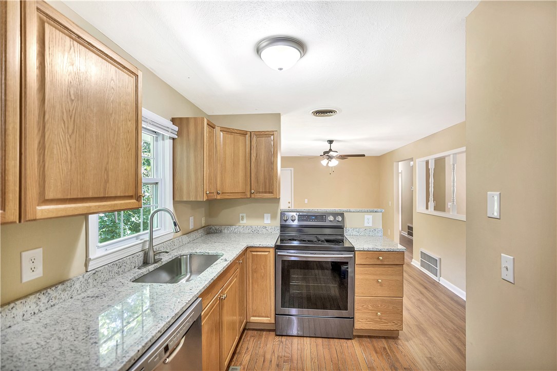 2011 Forest Drive Seneca, SC 29672 - Photo 15 of 36 Bright, airy kitchen with sleek appliances and ample counter space, perfect for culinary endeavors.