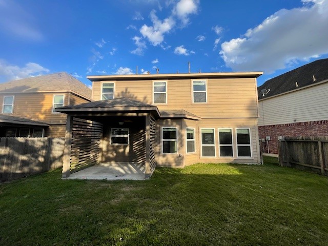 8115 Redbud Point Lane Houston, TX 77049 - Photo 13 of 14 front view of a house with a yard
