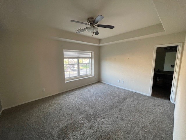 8115 Redbud Point Lane Houston, TX 77049 - Photo 7 of 14 an empty room with a ceiling fan and window