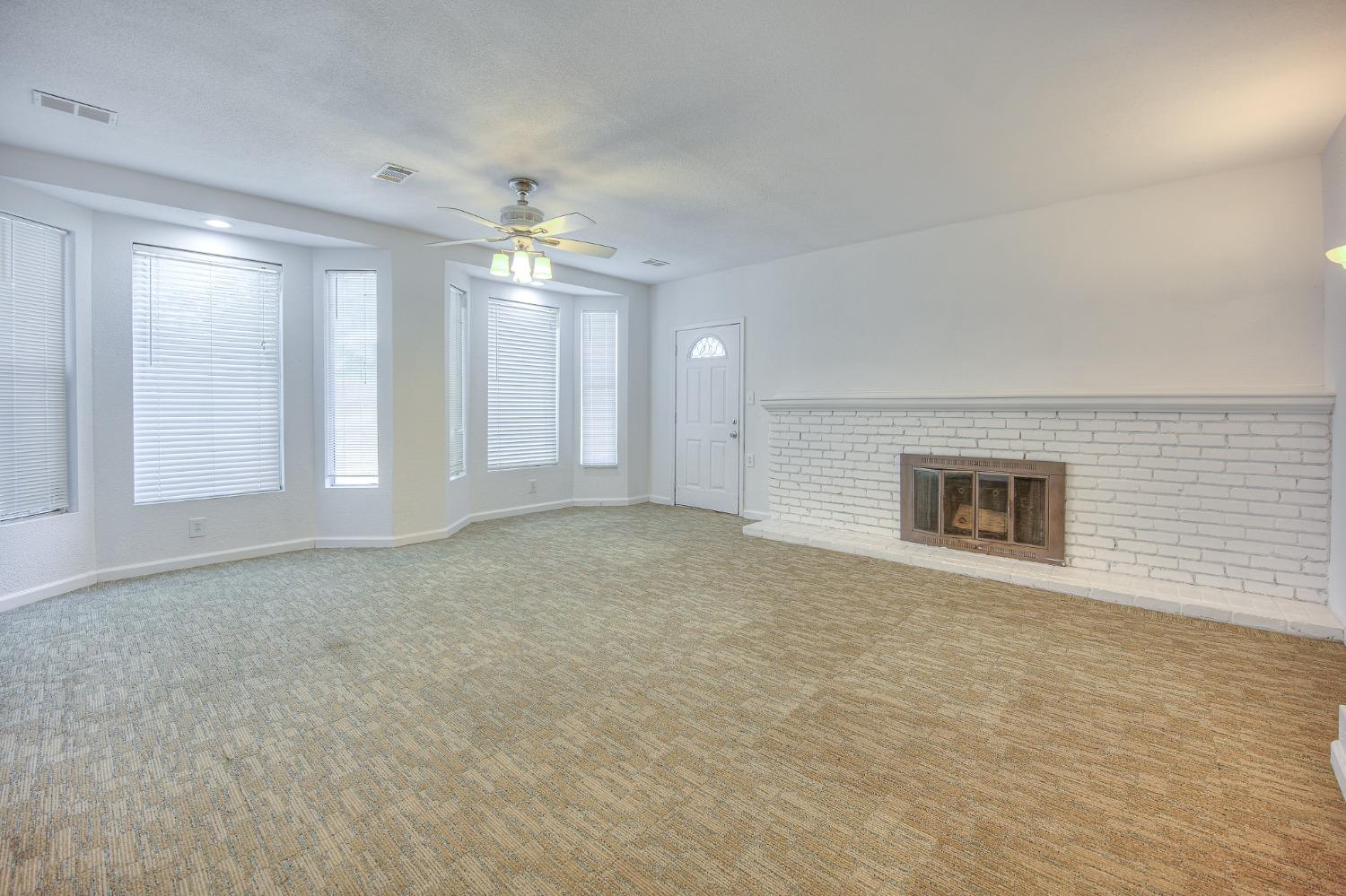 2811 North Winery Avenue Clovis, CA 93612 - Photo 13 of 25 a view of an empty room with a window