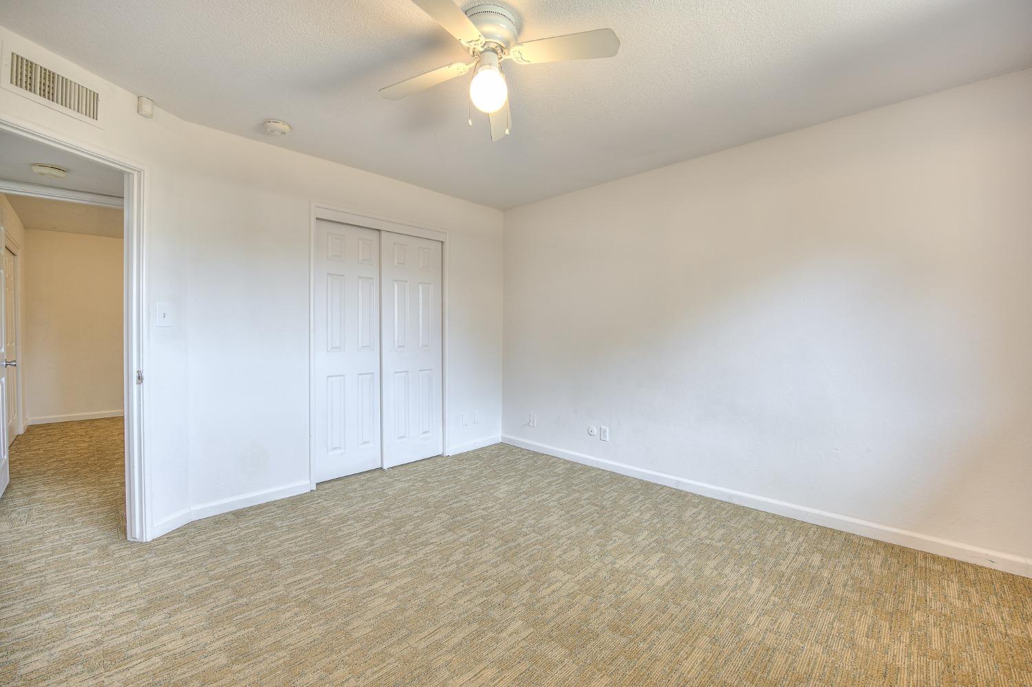 2811 North Winery Avenue Clovis, CA 93612 - Photo 19 of 25 a view of an empty room and chandelier fan