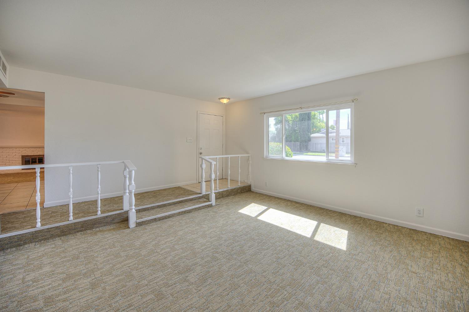 2811 North Winery Avenue Clovis, CA 93612 - Photo 9 of 25 an empty room with windows
