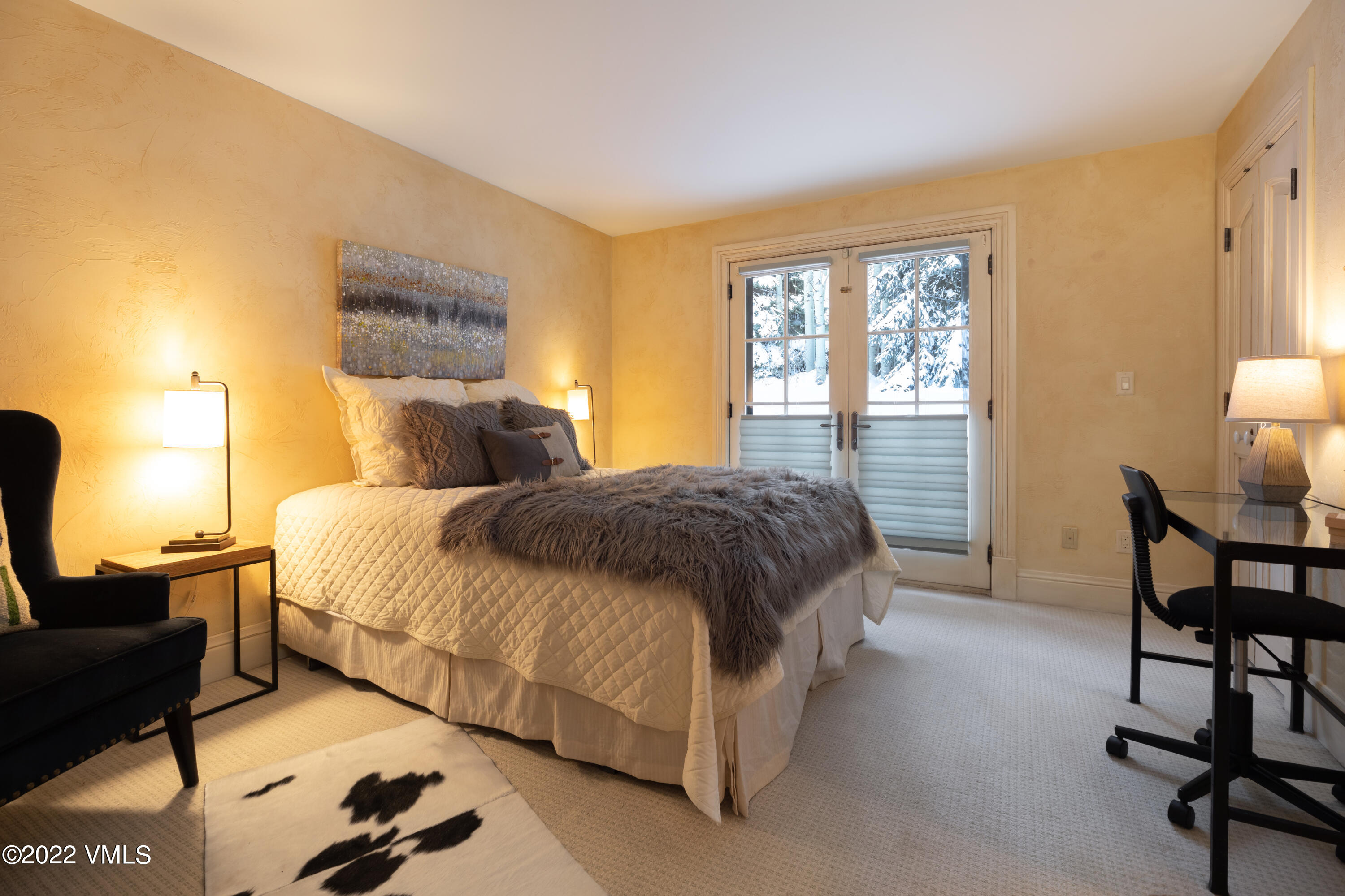 1328 Vail Valley Drive Vail, CO 81657 - Photo 11 of 13 a spacious bedroom with a bed chair and window