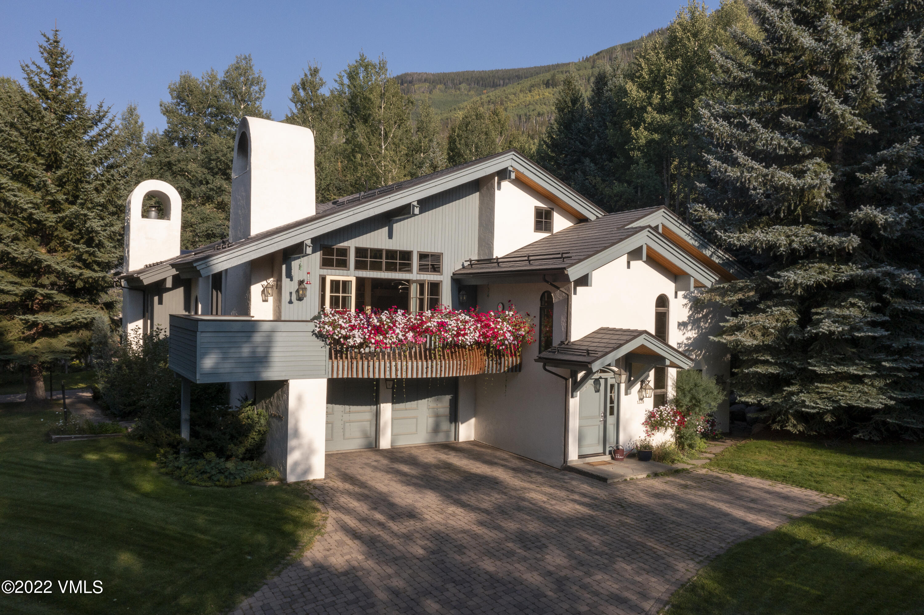 1328 Vail Valley Drive Vail, CO 81657 - Photo 13 of 13 a front view of house with yard and trees in the background