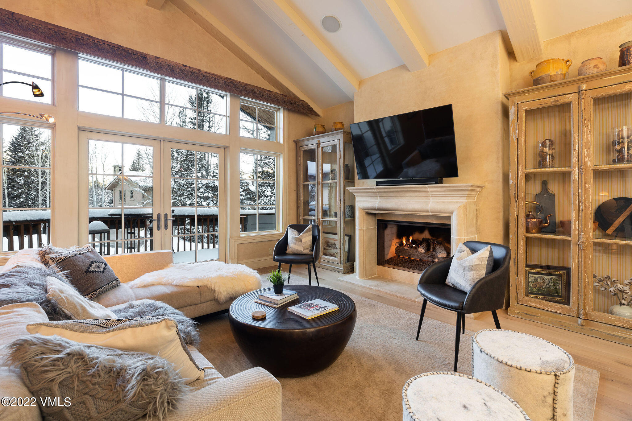 1328 Vail Valley Drive Vail, CO 81657 - Photo 3 of 13 a living room with furniture a fireplace and a flat screen tv