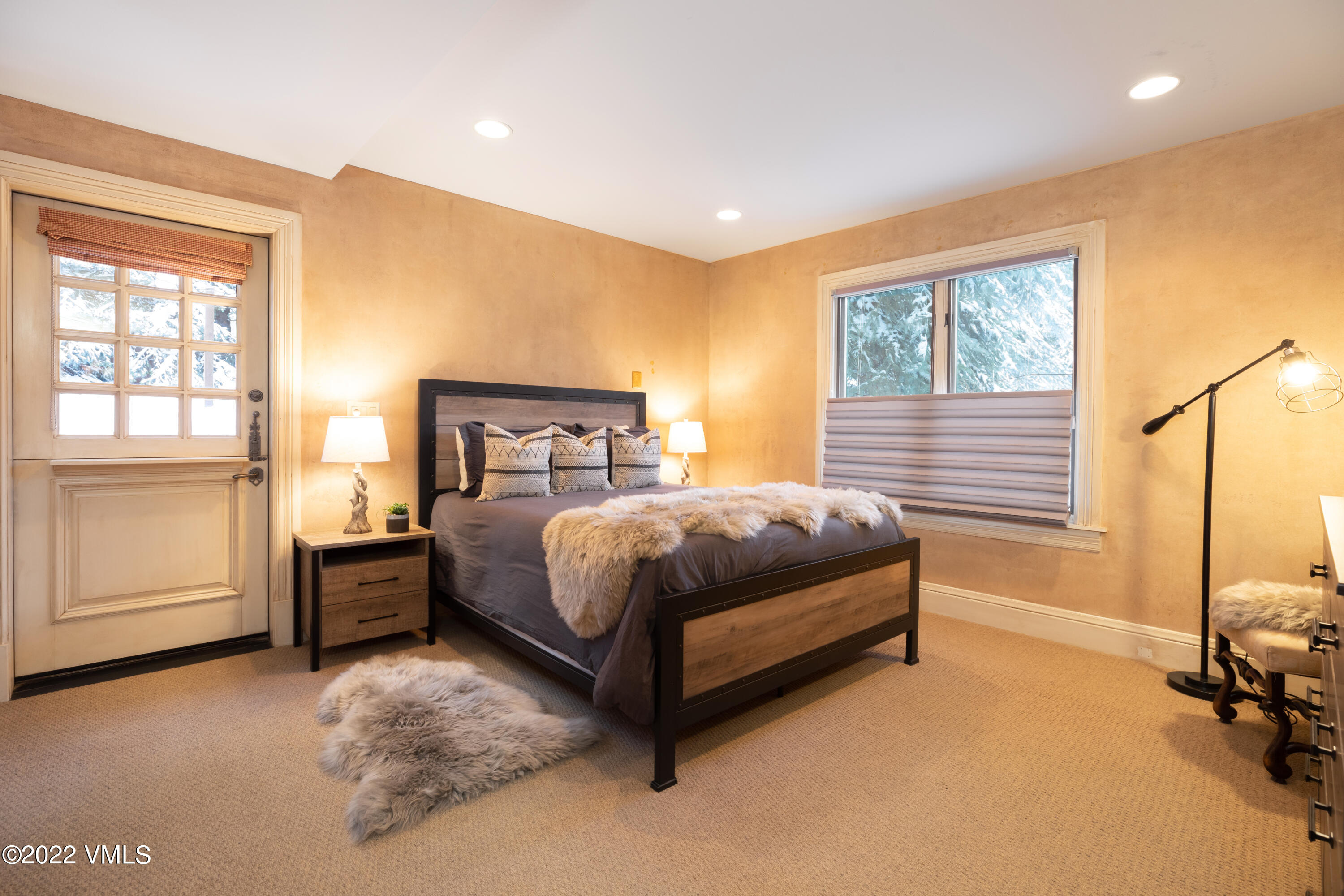 1328 Vail Valley Drive Vail, CO 81657 - Photo 10 of 13 a bedroom with a bed and cabinets