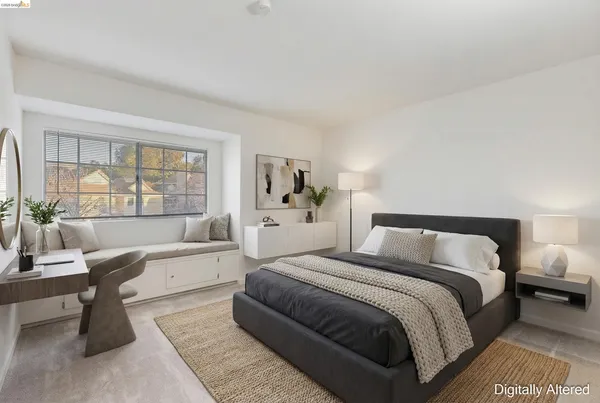 a bedroom with a large bed and a couch