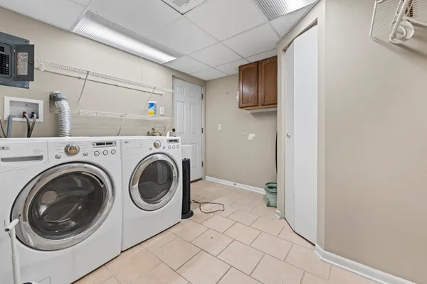 a view of a storage & utility room with washer and dryer