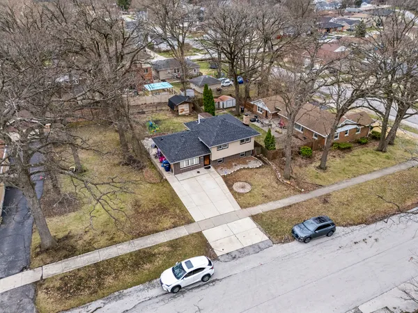 an aerial view of a house with outdoor space