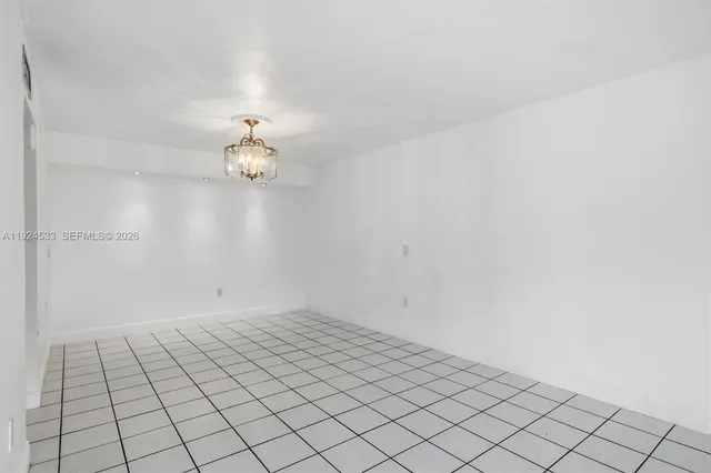 en empty room with wooden floor