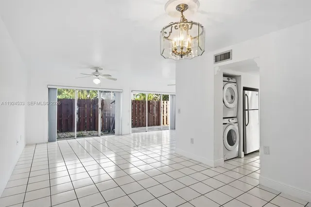 a kitchen with white cabinets stainless steel appliances and sink
