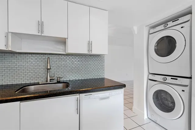 a bathroom with a toilet a sink and a window