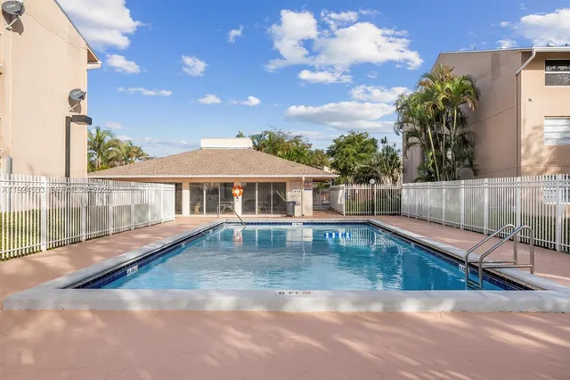 a view of a lake with a building in the background