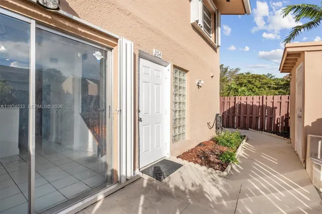 a view of a wooden door with a house