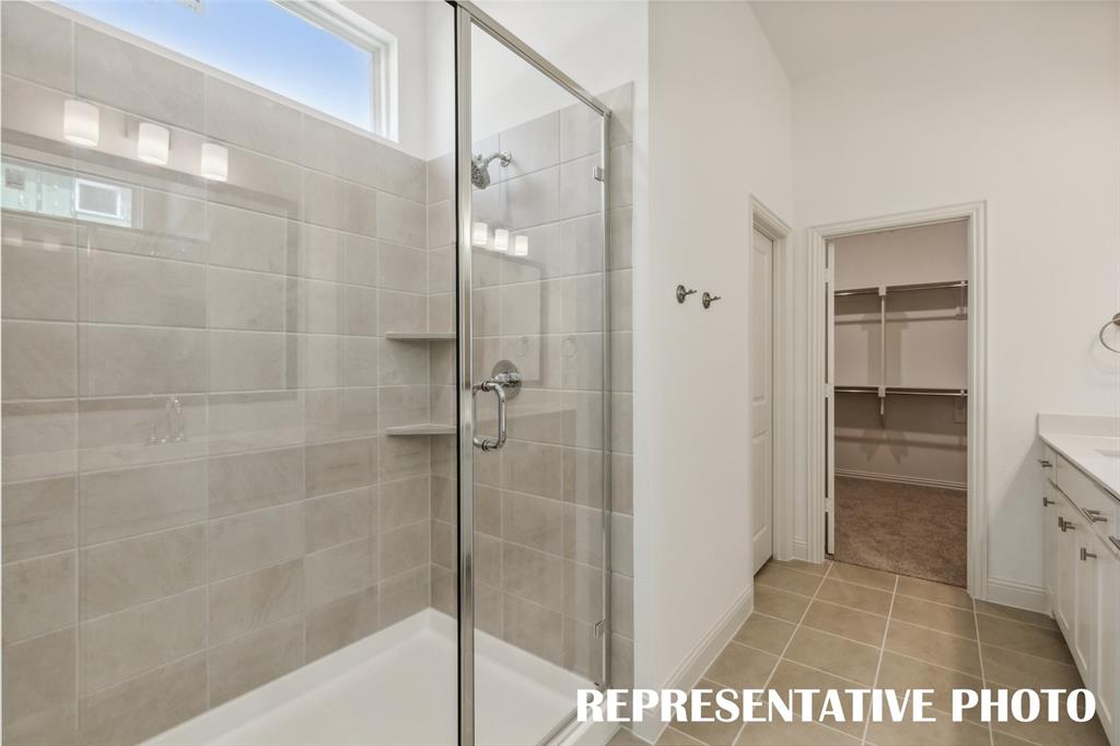 1034 Splitrock Drive Allen, TX 75013 - Photo 10 of 18 a bathroom with a shower and a sink