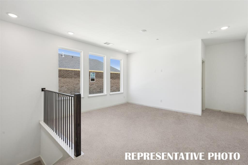 1034 Splitrock Drive Allen, TX 75013 - Photo 12 of 18 an empty room with windows